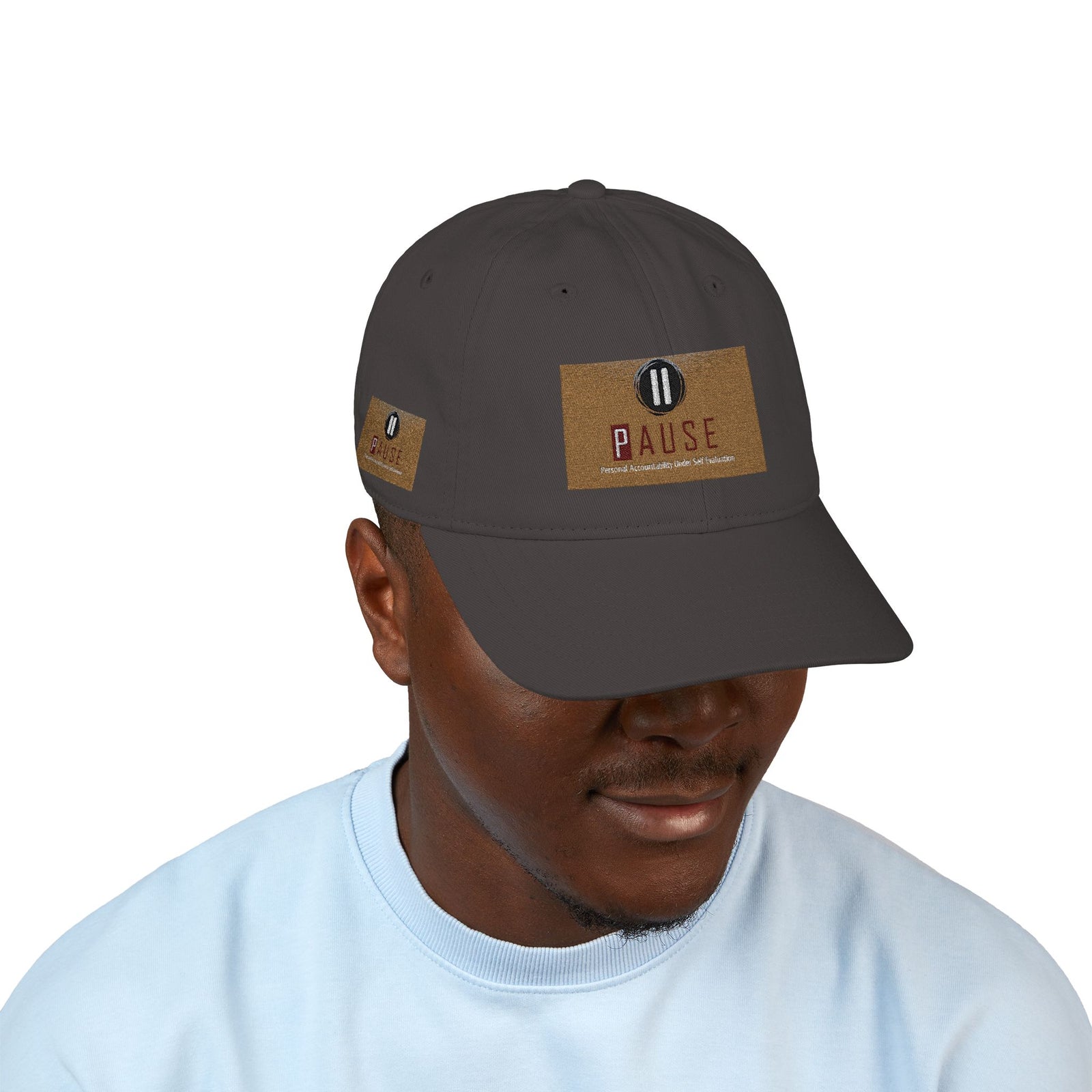 Cap Embroidered with 'Pause' Design